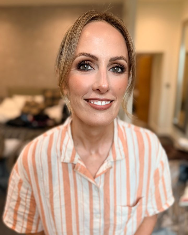Smokey eye makeup on a smiling client, by By.EmWebster